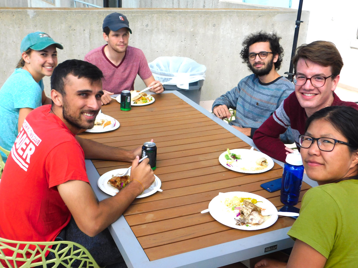 People sitting and eating at a table