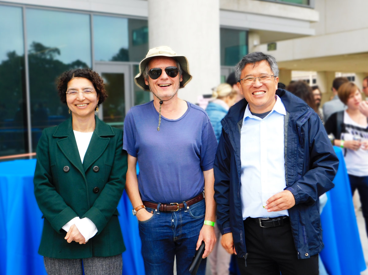 Three faculty standing for a picture